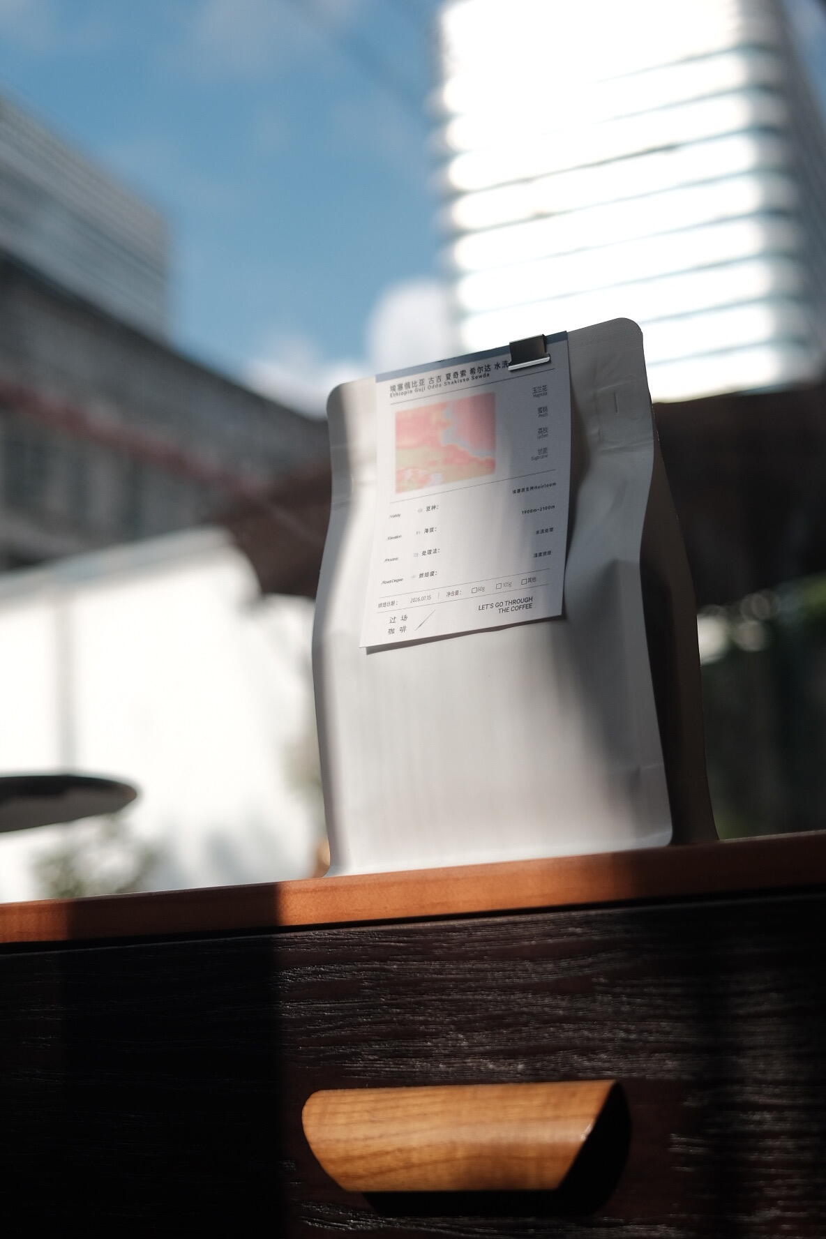 Coffee sample pouch in a window light